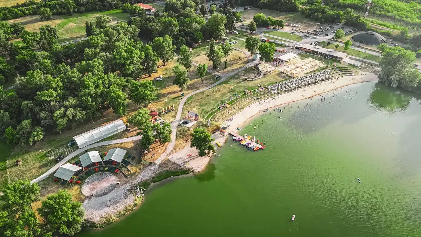 Aerial view of the Zelená Voda resort with the lake and beach